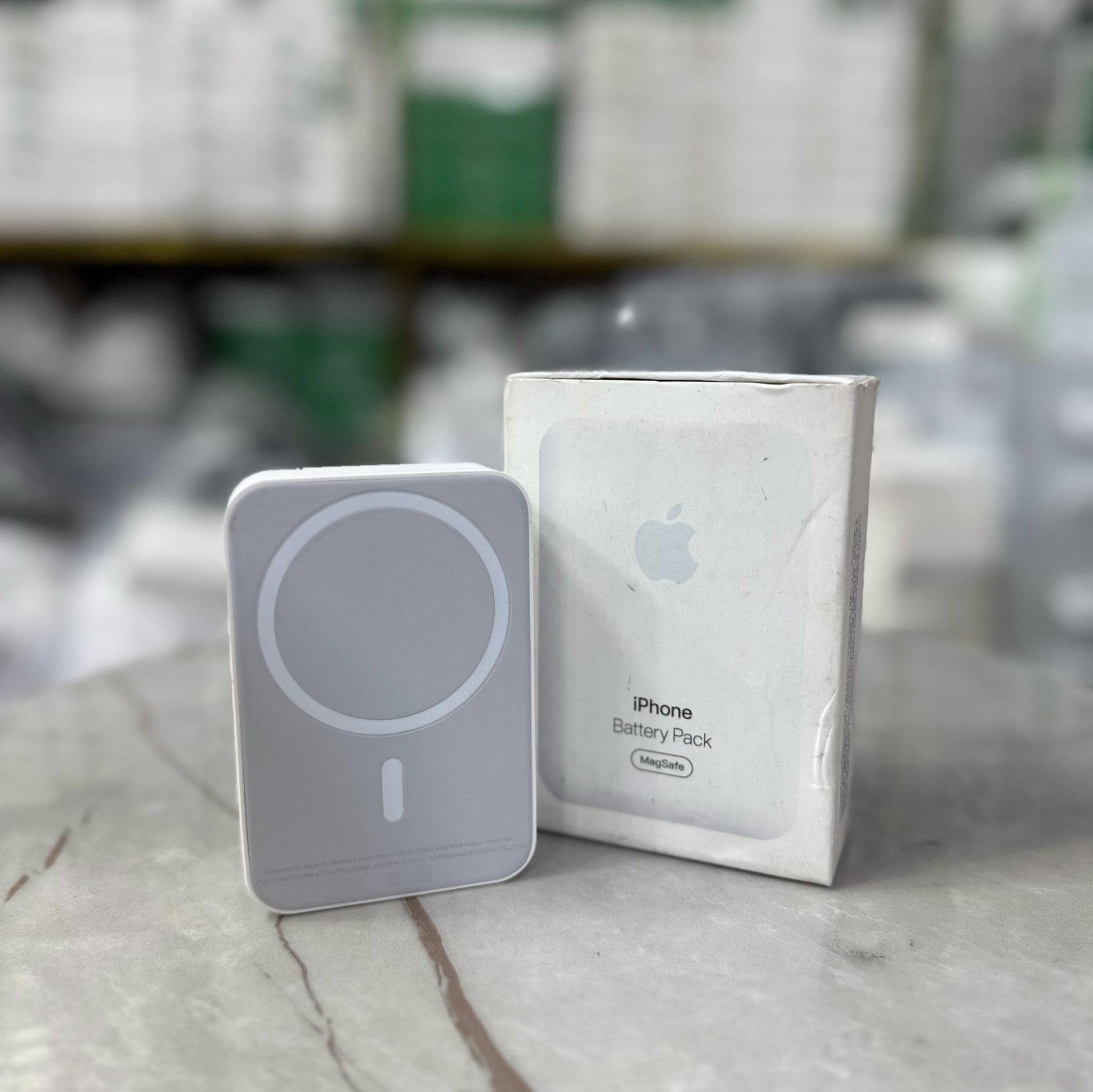 Slim and modern MagSafe-compatible wireless power banks in white, designed for fast and efficient charging. Featuring a sleek rectangular design with a circular magnetic alignment, these portable chargers provide seamless attachment for iPhone users seeki