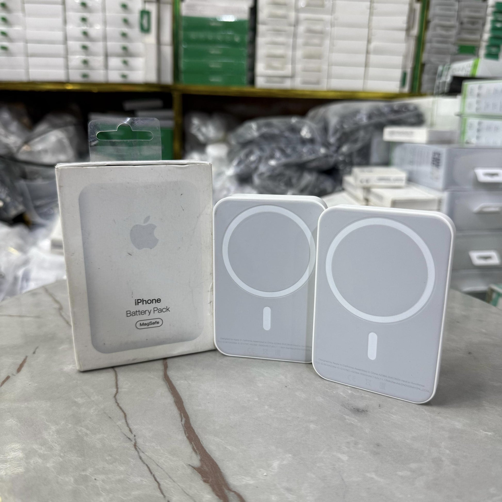 Slim and modern MagSafe-compatible wireless power banks in white, designed for fast and efficient charging. Featuring a sleek rectangular design with a circular magnetic alignment, these portable chargers provide seamless attachment for iPhone users seeki