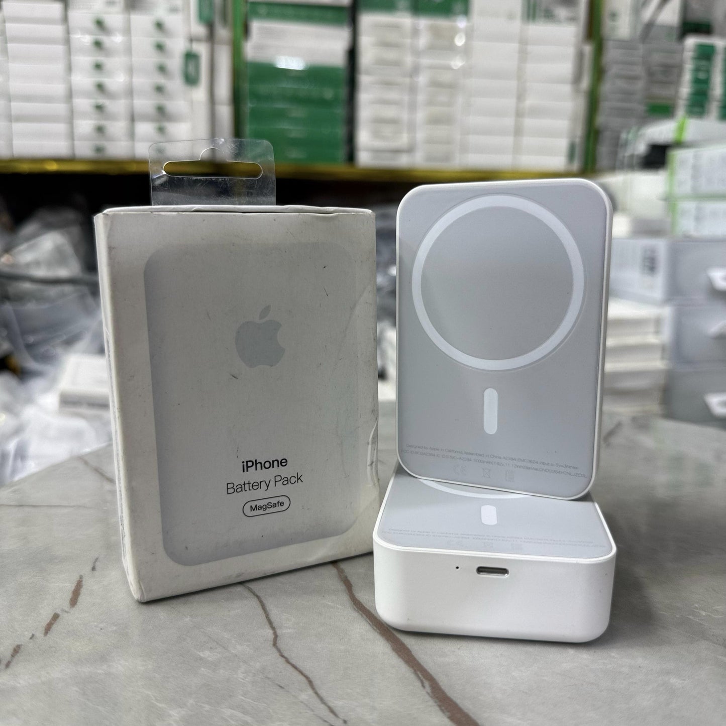 Slim and modern MagSafe-compatible wireless power banks in white, designed for fast and efficient charging. Featuring a sleek rectangular design with a circular magnetic alignment, these portable chargers provide seamless attachment for iPhone users seeki