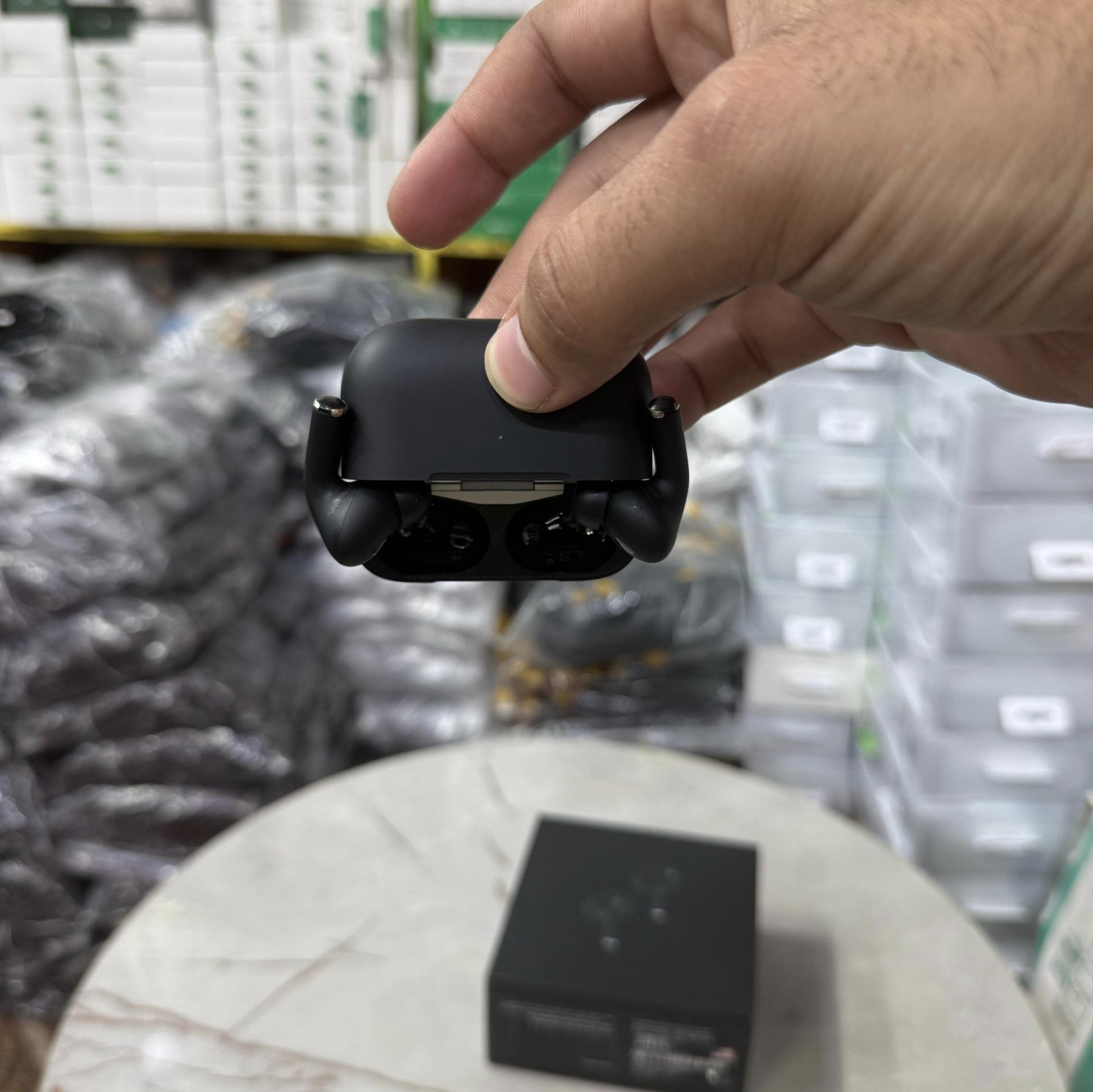 Matte black AirPods Pro-style wireless earbuds with active noise cancellation, displayed in an open charging case alongside a sleek black packaging box. The earbuds have a premium finish, making them a stylish choice for high-quality Bluetooth audio. Perf